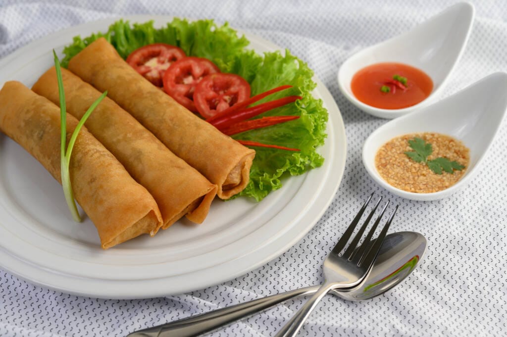 Crispy, golden, and packed with deliciously seasoned filling, our spring rolls are the perfect crunchy appetizer or snack. Served fresh and full of flavor!